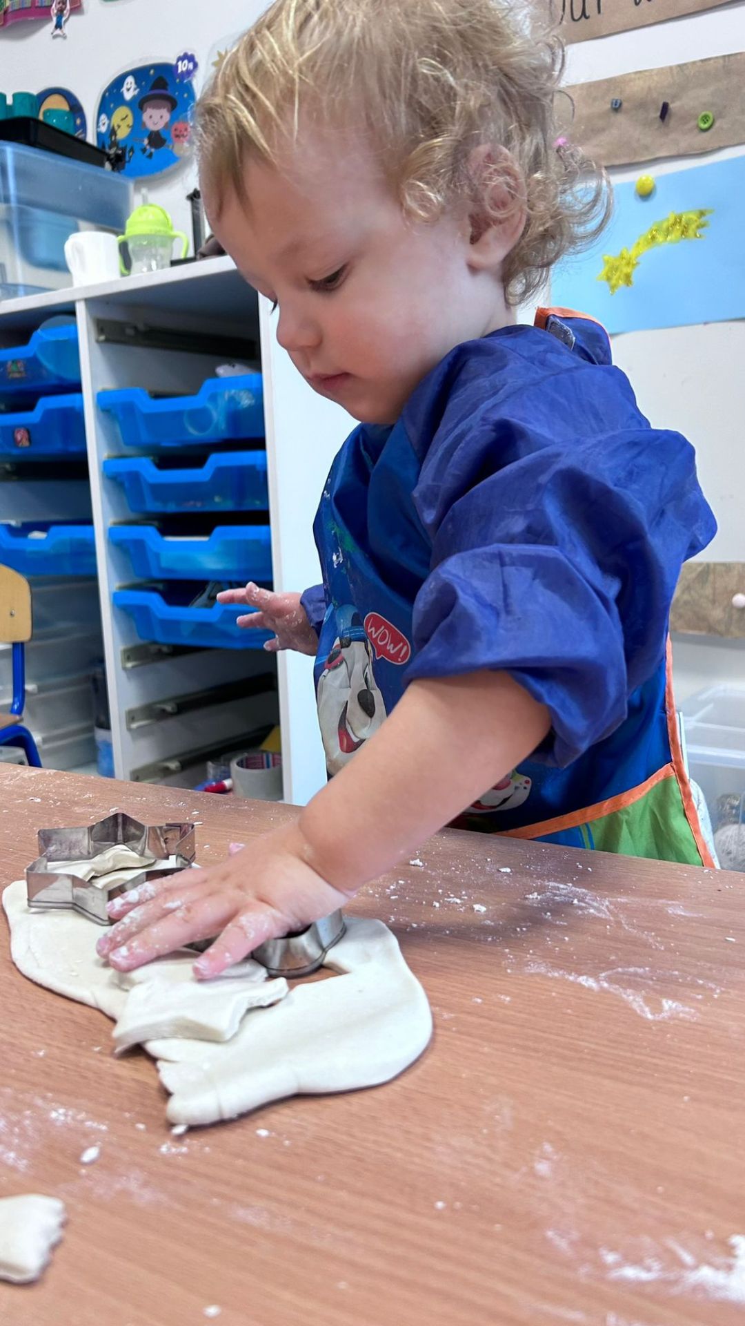 Child making cookies - ITSW nursery